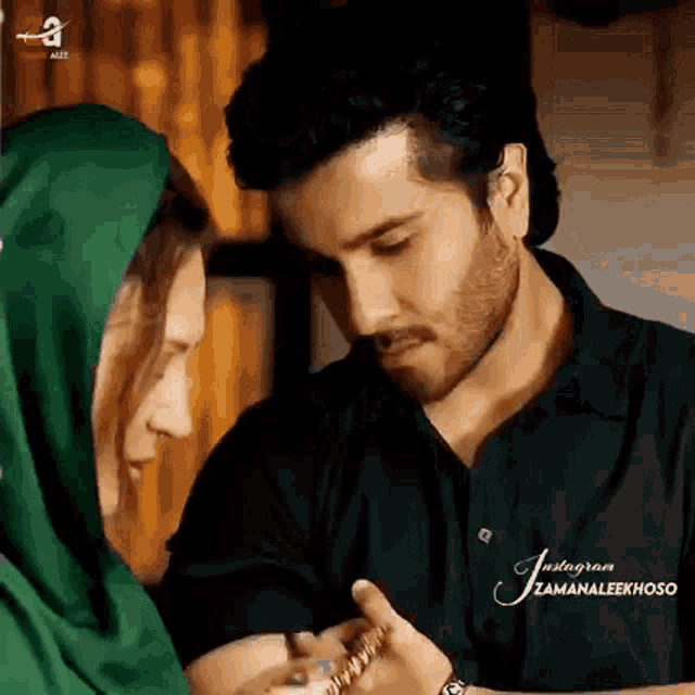 a man and a woman are looking into each other 's eyes .