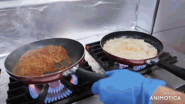 two pans of food are cooking on a stove and the words made in animotica are visible