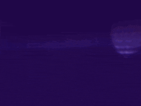 a pink and purple background with a circle of lights