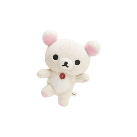 a white teddy bear with pink ears and a red button on its chest is sitting on a white surface .