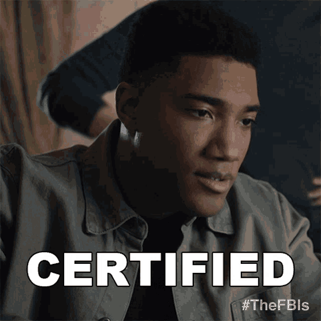 a man in a grey jacket says certified