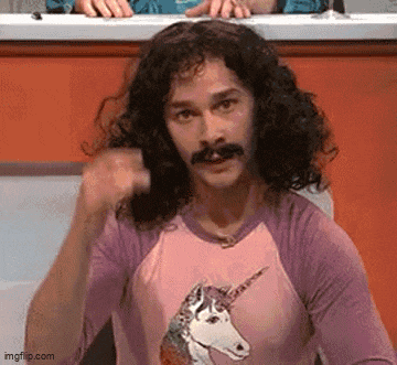 a man with long curly hair and a mustache is wearing a unicorn shirt .