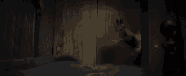 a blurred image of a person standing in a bedroom