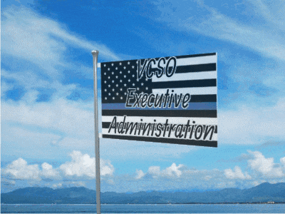 a flag that says vcso executive administration is flying in the wind