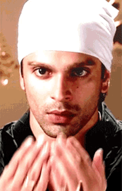 a man wearing a white bandana on his head