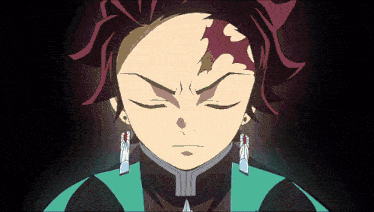 a close up of a person 's face with their eyes closed and earrings on