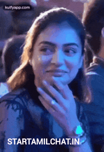a close up of a woman 's face with the words starttamilchat.in in the corner