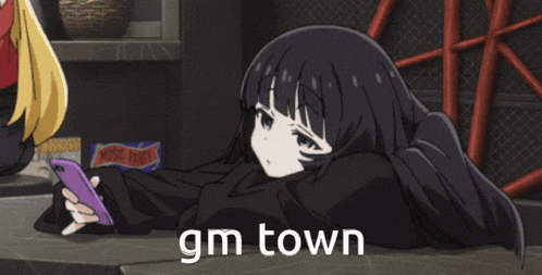 a girl laying down with a phone and the words gm town