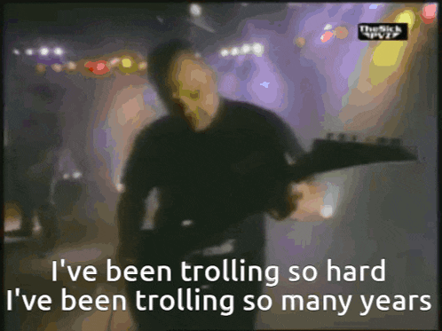 a blurry picture of a man playing a guitar with the words i 've been trolling so hard