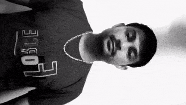 a man wearing a black t-shirt that says force