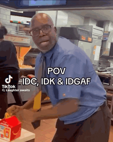 a man in a blue shirt and tie is dancing in a mcdonald 's restaurant .