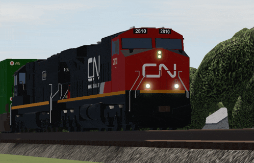 a red and black train with cn written on the front