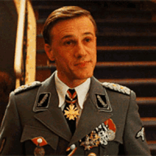 a man in a military uniform with the letter a on his sleeve