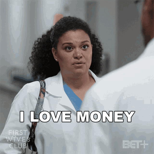 a woman in a lab coat says " i love money " in front of a man in a lab coat