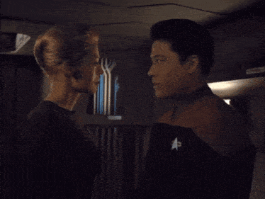a man and a woman are looking into each other 's eyes and the word resistance is above them