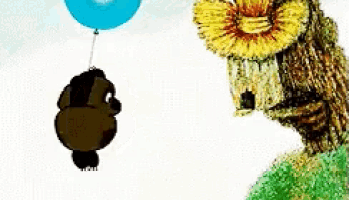 a stuffed animal is flying in the air with a blue balloon attached to it
