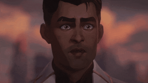 a close up of a man 's face with a surprised expression