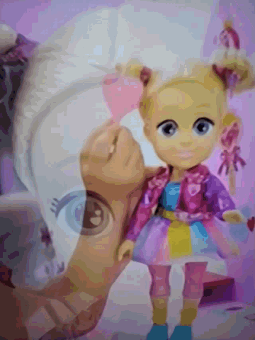 a doll laying on top of a horse with a purple background