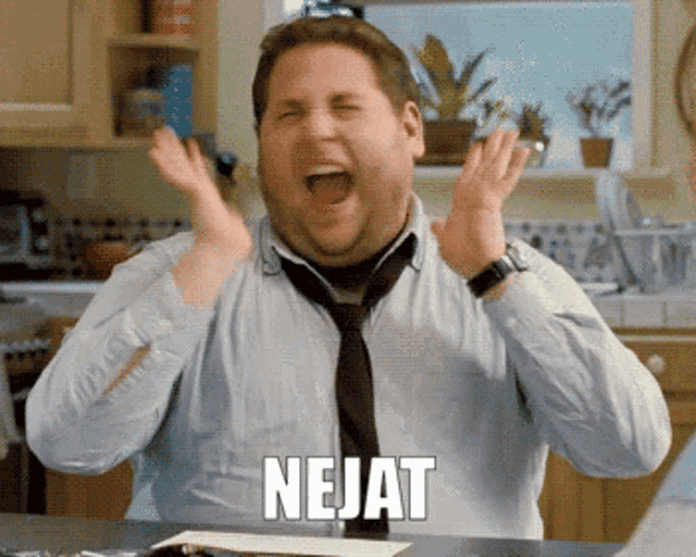 a man with his mouth open and the word nejat on his chest