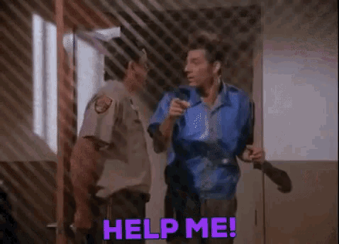 a man in a blue shirt is standing next to a police officer in a prison cell and asking for help .