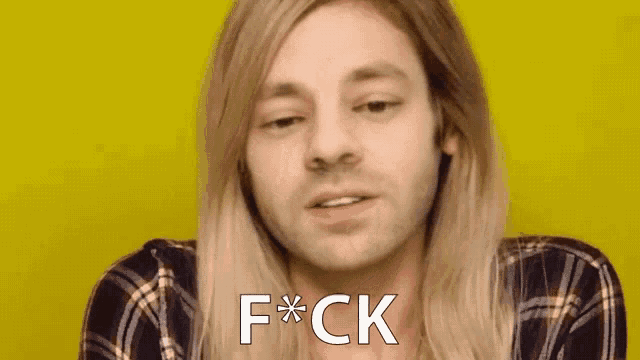 a man with long blonde hair says f * ck in front of a yellow background .
