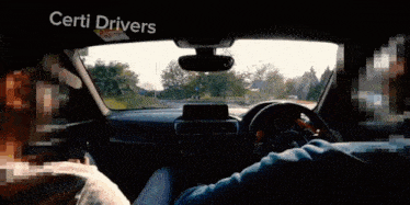 a man is driving a car and the words certi drivers are on the screen