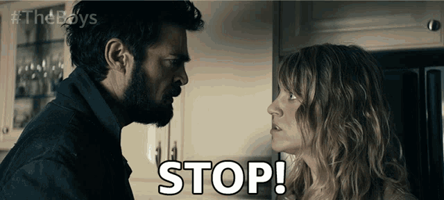 a man and a woman are looking at each other and the word stop is visible