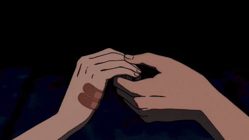 a person is holding another person 's hand with a fireworks display in the background