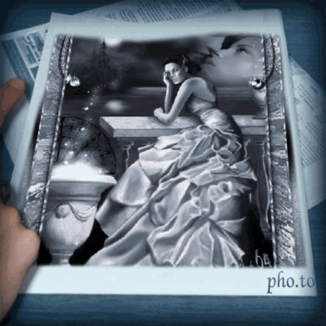 a photo of a woman in a white dress is being held up by someone