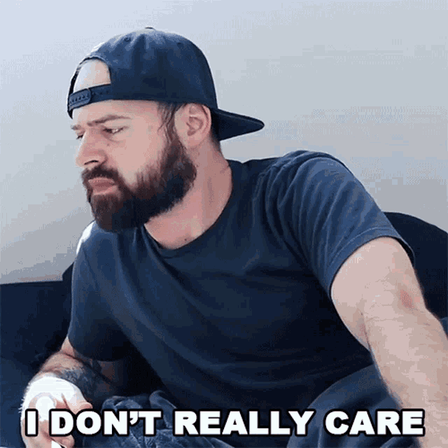 a man with a beard wearing a hat says i don t really care