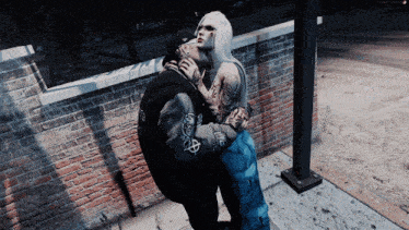 a man and a woman are kissing in a video game