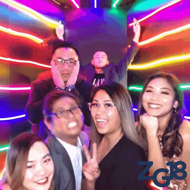 a group of people posing for a picture with the letters zg18 visible