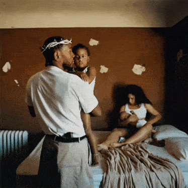 a man wearing a crown of thorns holds a child