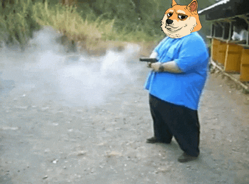 a man in a blue shirt with a dog on his face holds a gun