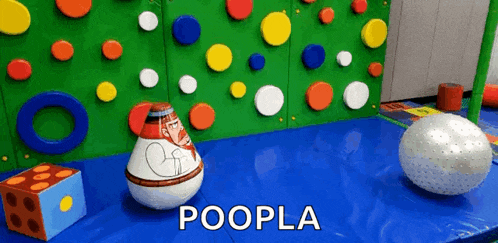 the word poopla is on the blue surface