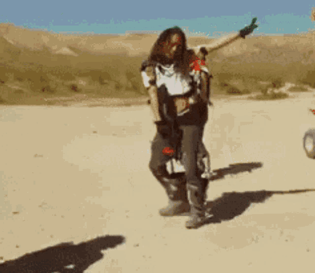 a man is carrying a woman on his back while riding a motorcycle