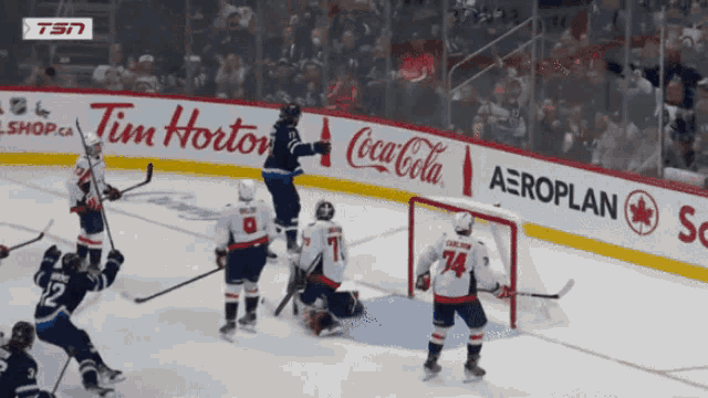 a hockey game sponsored by tim hortons coca cola and aeroplan is being played