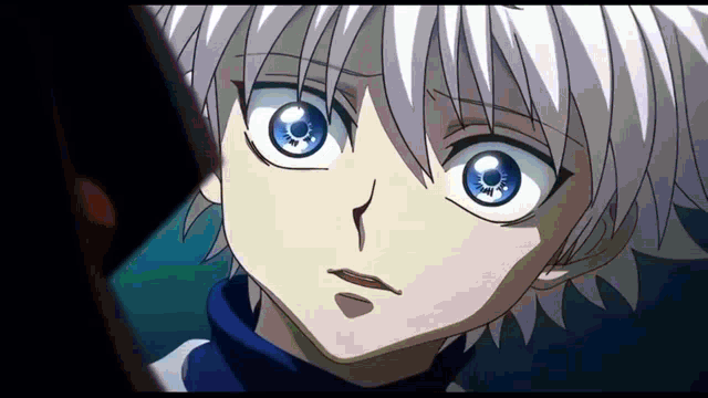 a close up of a person 's face with a blue eye