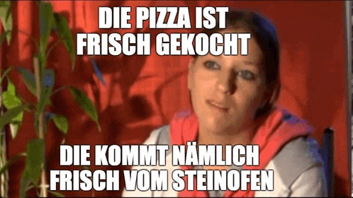 a woman is sitting in front of a red curtain with a caption that says die pizza ist frisch gekocht .