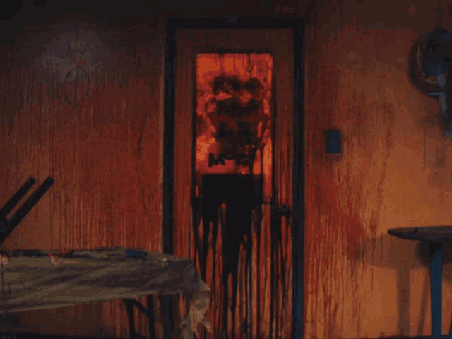 a man is standing in front of a mirror that says surf nasty room