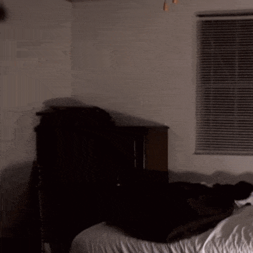 a blurry picture of a man in a dark room