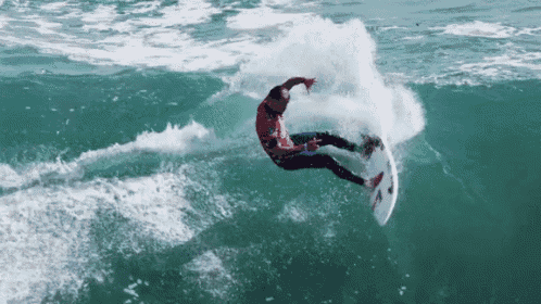 a man is riding a wave on a surfboard that says o'neill