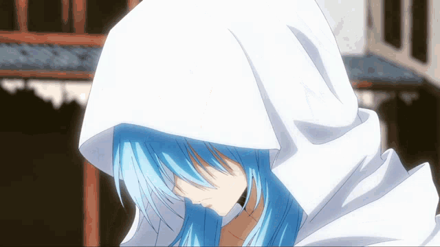 a person with blue hair wearing a white hood