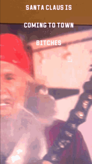 santa claus is coming to town bitches is written on a screen