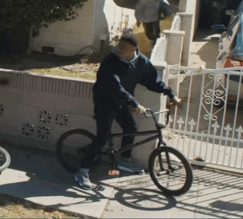 a man riding a bike with a sticker on the front that says ' ep '