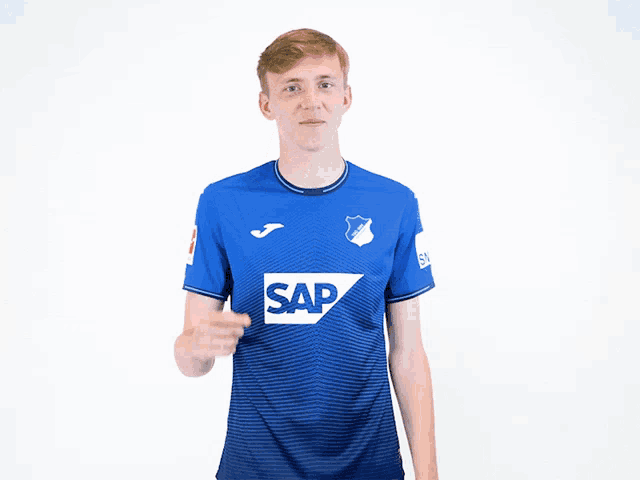 a boy wearing a blue shirt that says sap on it