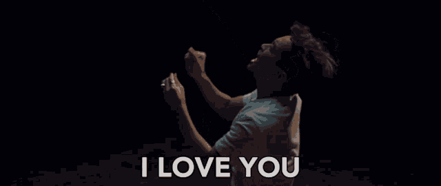 a man is saying i love you in a dark room