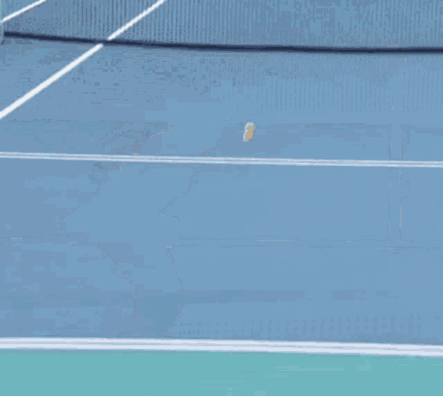 a woman is playing tennis on a court with an advertisement for itaú