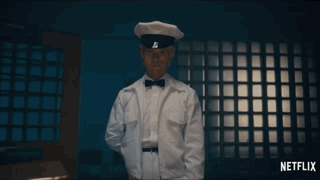 a man in a white uniform stands in front of a netflix ad