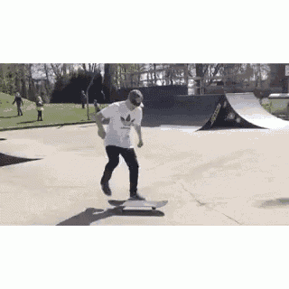 a young man is riding a skateboard at a skate park .